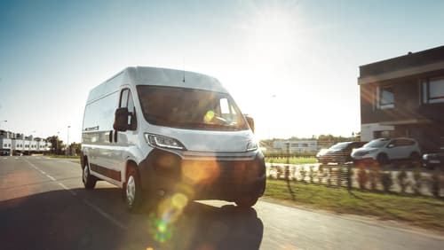 commercial vehicle driving down a road