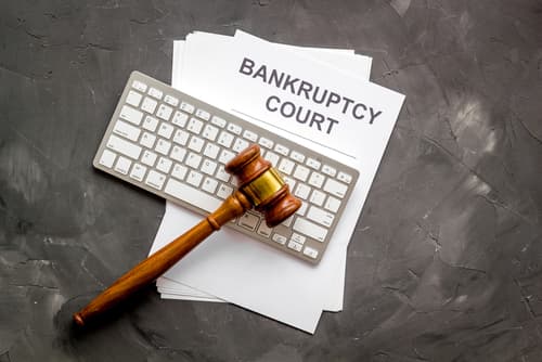gavel on keyboard and bankruptcy court papers