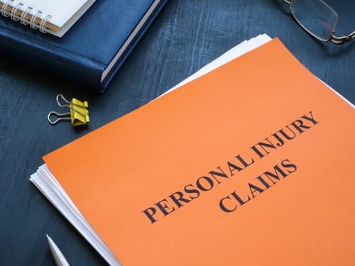 personal injury claims file on desk