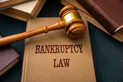 bankruptcy law book with gavel on table