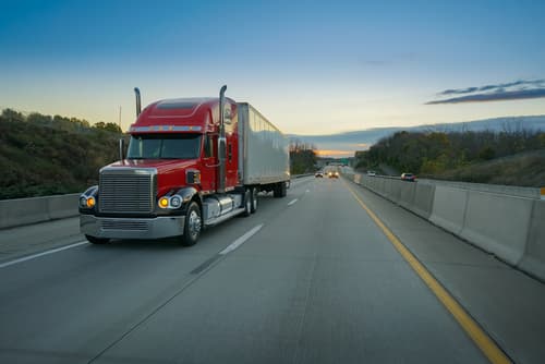 semi truck driving down highway