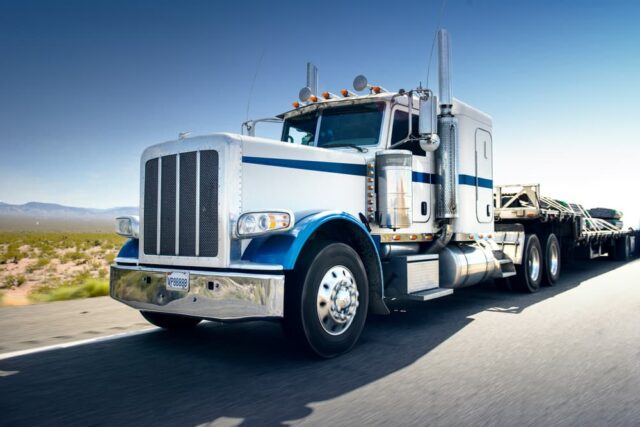 Truck on highway during daytime - transportation concept background