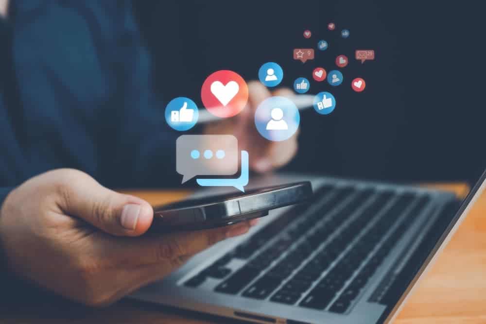 Man using smartphone, representing social media and digital connectivity. Concept of vacation lifestyle, remote work, and social distancing.