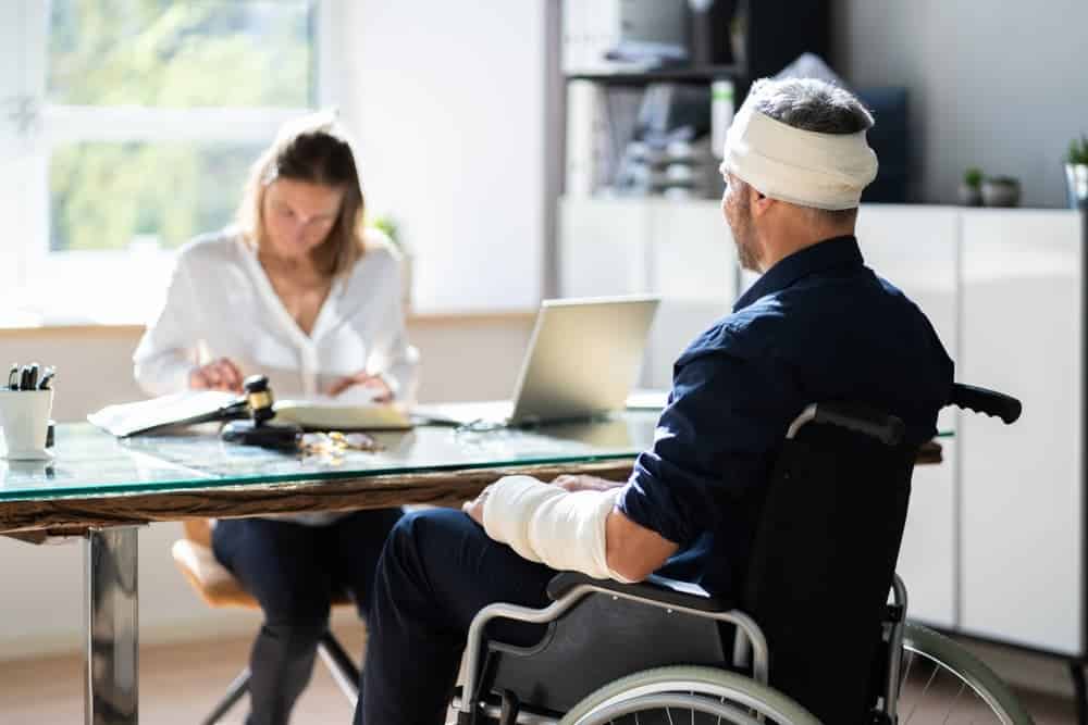 head injury victim meeting with a lawyer for compensation claim case